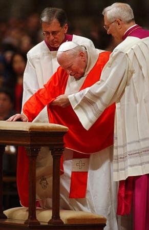 Pope John Paul II, Bishop Piero Marini, right, and Monsignor Renato Boccardo, St. Peter's Basilica, Vatican, Good Friday, March 29, 2002.