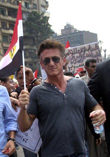 Photo: ‎American actor Sean Penn holds an Egyptian national flag in Tahrir Square (AP) النجم الأمريكي شون بن يرفع علم مصر وسط المتظاهرين بميدان التحرير اليوم- مليونية استرداد الثورة‎