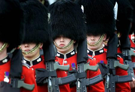 Members of the Grenadier Guards march through London in their trademark bearskins hats, 2001.