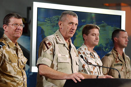 Gen. Tommy Franks, Commander of U.S. Central Command, British Air Marshal B.K. Burridge, left, Australian Brigadier Maurie McNarn, and Lt. Col. Jan Blom, right, of the Netherlands, news conference, Coalition Media Center, Camp AsSayliyah, Doha, Qatar, March 22, 2003.
