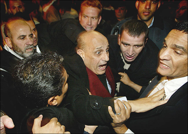 Egyptian Foreign Minister Ahmed Maher was hit, pushed and hurled with shoes by dozens of Palestinians as he entered al-Aqsa mosque in Jerusalem's Old City, December 22, 2003.