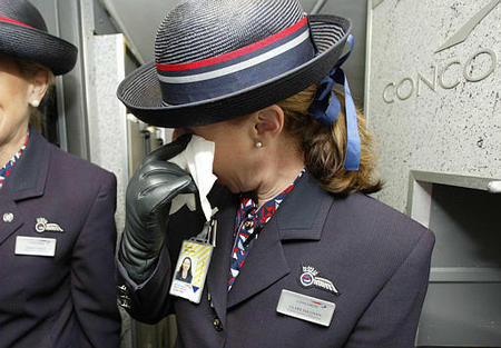 Cabin Service Director Claire Sullivan wipes away a tear, on the last commercial flight of Concorde from JFK to Heathrow, October 24, 2003.