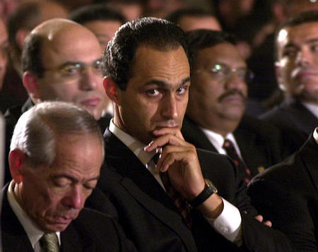 Egyptian President Hosni Mubarak's eldest son, Gamal, center, attends a midnight mass on Coptic Christmas Day at the Cairo Cathedral, January 7, 2003.