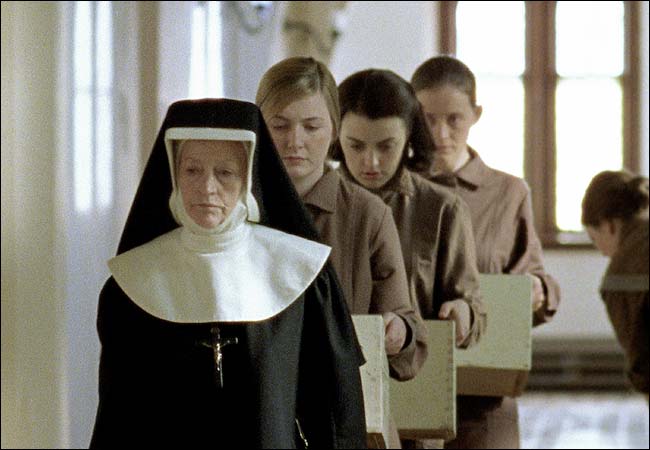 Dorothy Duffy, Nora-Jane Noone and Anne-Marie Duff, following a nun in the prisonlike laundry of The Magdalene Sisters movie (2002).