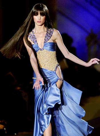 A model presents a dress as part of Versace's Spring-Summer 2004 haute couture fashion collection, Paris, January 19, 2004.