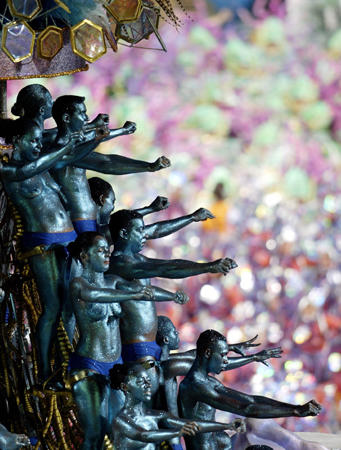 Revellers atop a float of the Unidos da Tijuca inside Rio de Janeiro's Sambodrome during the first of two nights of competition, Rio de Janeiros annual Carnival, February 22, 2004.