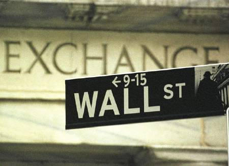 Wall Street street sign in front of the New York Stock Exchange, New York, September 21, 2000.