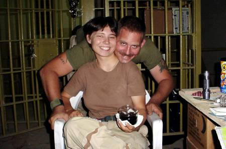 Pfc. Lynndie R. England and U.S. Army Spec. Charles A. Graner, Jr., are shown in this undated photograph at Abu Ghraib prison in Iraq.
