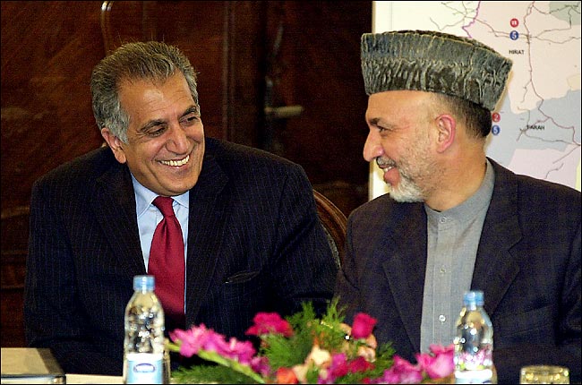 Zalmay M. Khalilzad, the United States ambassador to Afghanistan with Afghanistan's president, Hamid Karzai, as they sat in Mr. Karzai's office, April 2004.
