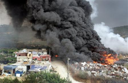 Smoke billows from a blaze started by an explosion in Kfarshima, near Beirut, as a part of Israeli air raids that shooked Beirut on the sixth day of a devastating assault on Hezbollah, July 17, 2006.