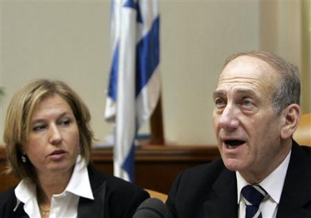 Israeli Foreign Minister Tzipi Livni looks in as Israeli Prime Minister Ehud Olmert chairs the weekly Israeli cabinet meeting, Jerusalem, August 20, 2006.