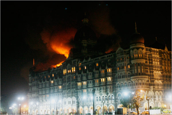 In the second day of attacks, the landmark Taj Mahal Palace & Tower Hotel, is set into fire by Muslim invaders whose teams stormed luxury hotels, a popular restaurant, a crowded train station and a Jewish group's headquarters, killing people, and holding Westerners hostage in coordinated attacks on the India's commercial center, Mumbai, November 27, 2008.