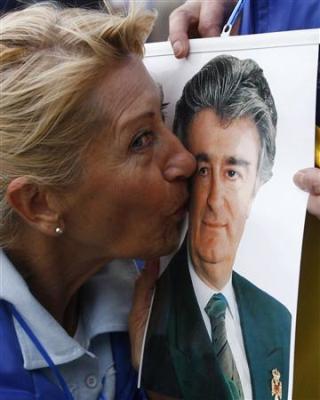 A Serb woman kisses a picture of Radovan Karadzic during a demonstration, Belgrade July 23, 2008.