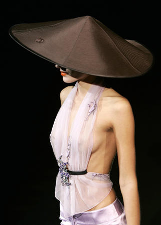 A model presents a creations as part of Giorgio Armani Spring-Summer 2005 women's collection during Milan fashion week, September 2004.
