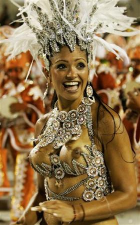 Thatiana Pagung performs as queen of the 'Viradouro' samba school drum section during carnival parade in Rio de Janeiro on early February 19, 2006.