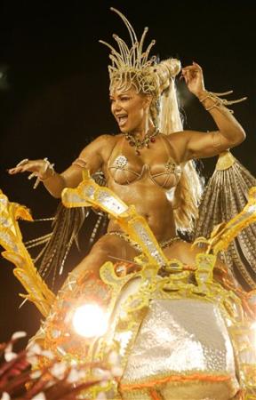 A dancer performs on top of a 'Porto da Pedra' float during Carnival parade, Rio de Janeiro, February 19, 2007.