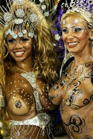 Angela Bismarchi, right, and Elaine Ribeiro, left, of the 'Porto da Pedra' samba school pose during Carnival parade in Rio de Janeiro, February 19, 2007.