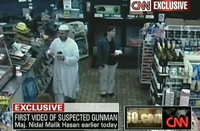 A still image from a convenience store surveillance camera shows Major Nidal Malik Hasan, left, on the morning just before he commits the Fort Hood military base massacre, Texas, November 5, 2009.