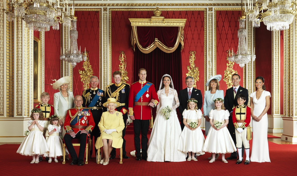 Britain's Prince William and his bride Catherine, Duchess of Cambridge (c), pose for an official photograph, with their families (front row left to right: Miss Grace van Cutsem, Miss Eliza Lopes, HRH Prince Philip the Duke of Edinburgh, HM Elizabeth II the Queen, The Hon. Margarita Armstrong-Jones, Lady Louise Windsor, Master William Lowther-Pinkerton; back row left to right: Master Tom Pettifer, HRH Duchess Camilla of Cornwall, HRH Prince Charles of Wales, HRH Prince Harry of Wales, Mr. Michael Middleton, Mrs. Michael Middleton, Mr. James Middleton, Miss Philippa Middleton), on the day of their wedding, the throne room at Buckingham Palace, Central London, April 29, 2011.