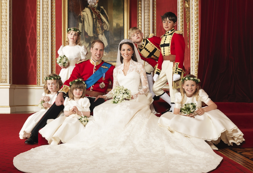 Britain's Prince William and his bride Catherine, Duchess of Cambridge (c), with attendants, (clockwise from bottom right: The Hon. Margarita Armstrong-Jones, Miss Eliza Lopes, Miss Grace van Cutsem, Lady Louise Windsor, Master Tom Pettifer, Master William Lowther-Pinkerton), on the day of their wedding, the throne room at Buckingham Palace, Central London, April 29, 2011.