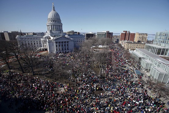In opposition to the opposition which overran the capital city for much of the week by union supporters, state employees and students; a counterdemonstration, self-described Tea Party, members and other fiscal conservatives show their support for the Governor Scott Walkers plan to cut collective bargaining rights and benefits for public workers, Madison, Wisconsin, February 19, 2011.