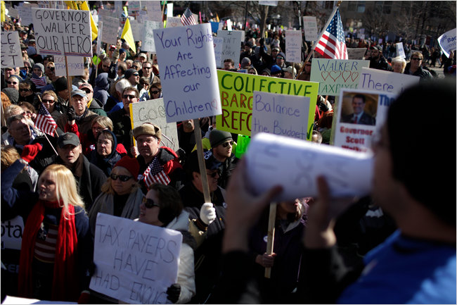 In opposition to the opposition which overran the capital city for much of the week by union supporters, state employees and students; a counterdemonstration, self-described Tea Party, members and other fiscal conservatives show their support for the Governor Scott Walkers plan to cut collective bargaining rights and benefits for public workers, Madison, Wisconsin, February 19, 2011.