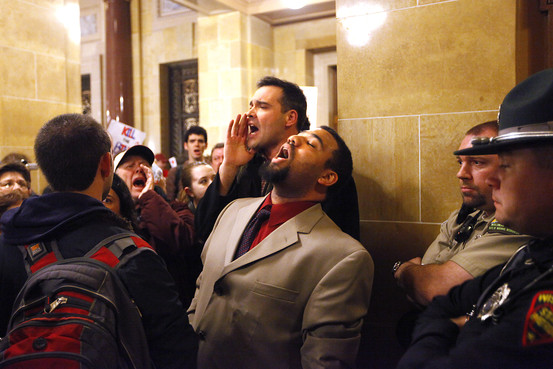 Union supporters, state employees and students protest against Wisconsin Governor Scott Walker's budget repair bill, outside the senate parlor as legislators inside vote to move forward on an amended version of the bill that could end the collective bargaining rights for government employees, the Wisconsin State Capitol Building, Madison, March 9, 2011.