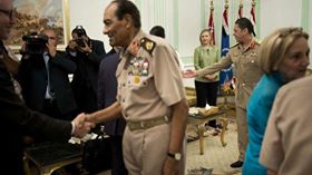 ‎US Secretary of State Hillary Rodham Clinton, back center, watches as Field Marshal Hussein Tantawi, second left, greets members of the American delegation before a meeting at the Ministry of Defense, Cairo, Egypt, July 15, 2012.

التعليق هنا
https://www.facebook.com/EveryScreen/posts/264501396989822‎