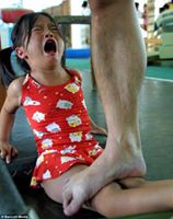 ‎With her face etched with pain, a child trains for Olympic glory while her gymnastics trainer stands on her legs, in Nanning Gymnasium, one of many ruthless training camps across the country to which parents send their children to learn how to be champions, Nanning, China, 2012.

التعليق هنا
https://www.facebook.com/EveryScreen/posts/351261391621007‎