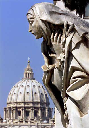 Saint Peter's Basilica and a statue depicting Saint Catherine at the Vatican.