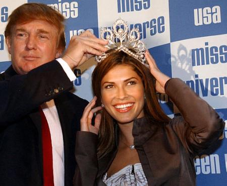 New York real estate tycoon Donald Trump, owner of the Miss Universe contest, crowning Justine Pasek of Panama, New York, September 24, 2002.