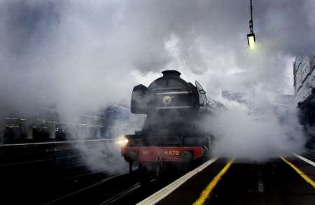 The world famous Flying Scotsman steam locomotive, holder of three steam speed records, pulls out of Victoria Station, London, March 13, 2002.