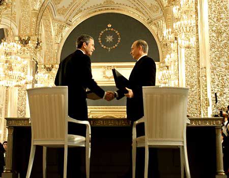 President George W. Bush and Russian President Vladimir Putin upon signing the landmark arms control Treaty of Moscow in St. Andrews Hall, the Kremlin, May 24, 2002.
