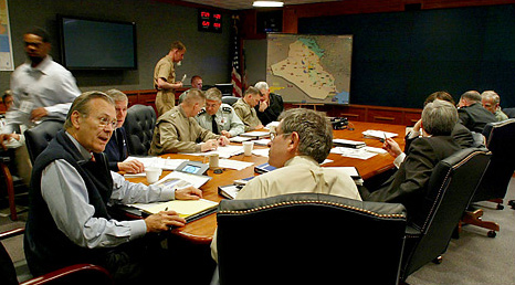 Defense Secretary Donald H. Rumsfeld, and Deputy Defense Secretary Paul D. Wolfowitz, minutes before a videoconference briefing by General Tommy R. Franks, a secure conference room at the Pentagon, April 11, 2003.