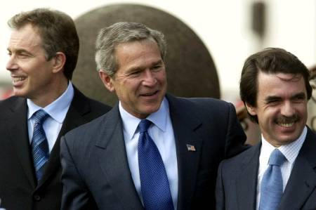 U.S. President George W. Bush (C), British Prime Minister Tony Blair and Spanish Prime Minister Jose Maria Aznar, Terceira air base, Azores Islands, Portugal, March 16, 2003.