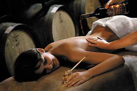 White Oak's Spa's 'Nectar of Niagara Scrub and Massage' is incorporating the region's wines into a therapeutic treatment, a technique that includes a rub down with a sticky mixture of honey and sweet wine. A photo taken during Canada's Shaw Festival, September 11, 2002.
