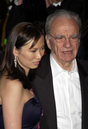Rupert Murdoch and his wife Wendi leaving the Vanity Fair post Oscars party, Morton's restaurant, Los Angeles, early March 25, 2003.