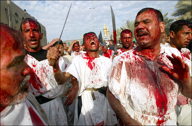 To mark the anniversary of the killing of Imam Hussein, Shiites in Karbala beat themselves to atone for the collective guilt of their ancestors who failed to come to Hussein's aid, April 23, 2003.