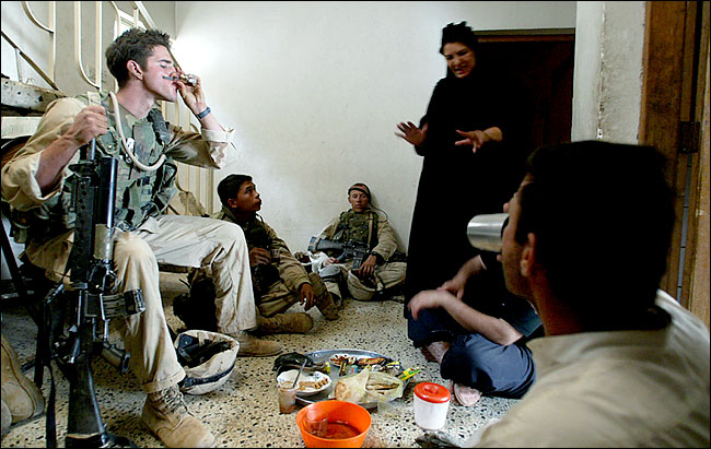 Marines accepted tea from Salwa Meseen, Baghdad, April 8, 2003.