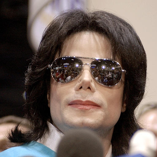 Michael Jackson waits at the Major Broadcasting Cable Network booth, the National Cable and Telecommunications Association show, Chicago, June 9, 2003.