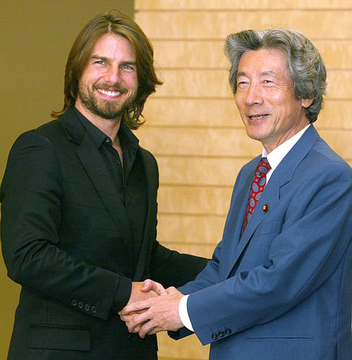 Movie star Tom Cruise, who is in Japan to promote his new work The Last Samurai, grins with Japanese Prime Minister Junichiro Koizumi, Koizumi's official residence, Tokyo, August 28, 2003.