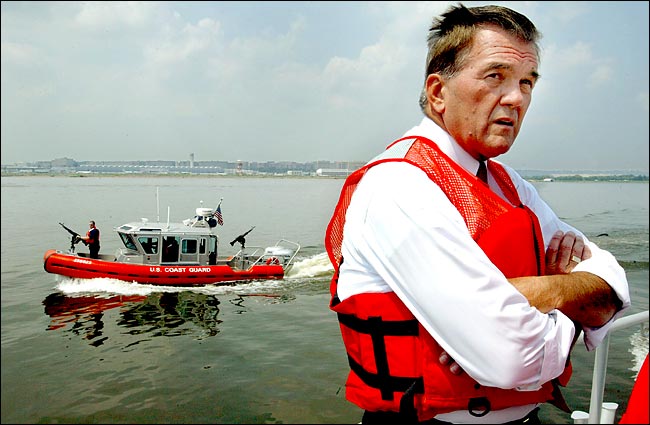 Tom Ridge, the secretary of homeland security, in view of Ronald Reagan National Airport during a demonstration of maritime security, Washington, August 6, 2003.