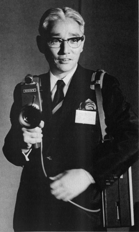 Akio Morita holding the DVK-2400 ensemble which consists of the DVC-2400 Camera and the legendary first portapack VTR named Video Rover, 1966.