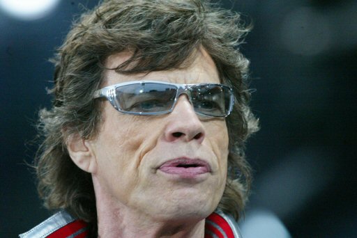 Mick Jagger of the Rolling Stones performs on stage during the European Start of the 'Licks World Tour' in the Olympic Stadium in Munich, southern Germany, June 6, 2003. 