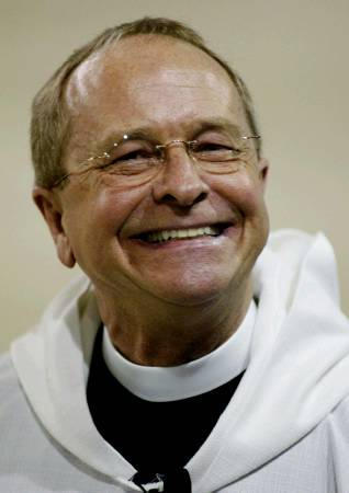 Amid fears that his consecration with cause a spilt in the worldwide Anglican Church, the Reverend Gene Robinson smiles as he enters his consecration ceremony as the first openly gay bishop in the Episcopal Church in Durham, New Hampshire, November 3, 2003.