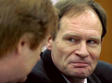 Armin Meiwes, right, talks to his lawyer Harald Ermel at the regional court in Kassel, Germany, December 29, 2003.