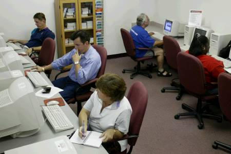 People search for job possibilities on the internet, Casselberry, Florida, July 2003.