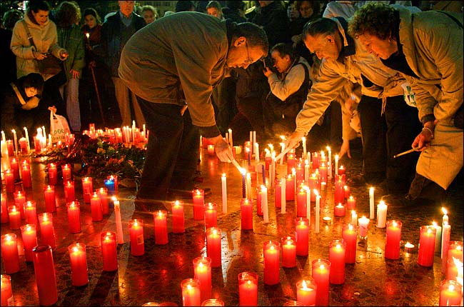 Thousands of citizens placed candles on the pavement in a vigil to condemn the Madrid bombings, central Barcelona, March 11, 2004.