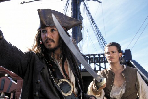 Johnny Depp as Captain Jack Sparrow and Orlando Bloom as Will Turner in Pirates of the Caribbean –The Curse of the Black Pearl (2003).
