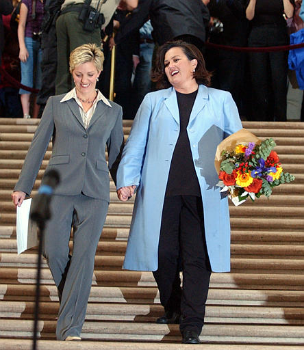 Comedian, Actress and Former talk show host Rosie O'Donnell, right, walks with her partner Kelli Carpenter, after getting married at the City Hall, San Francisco, February 26, 2004.